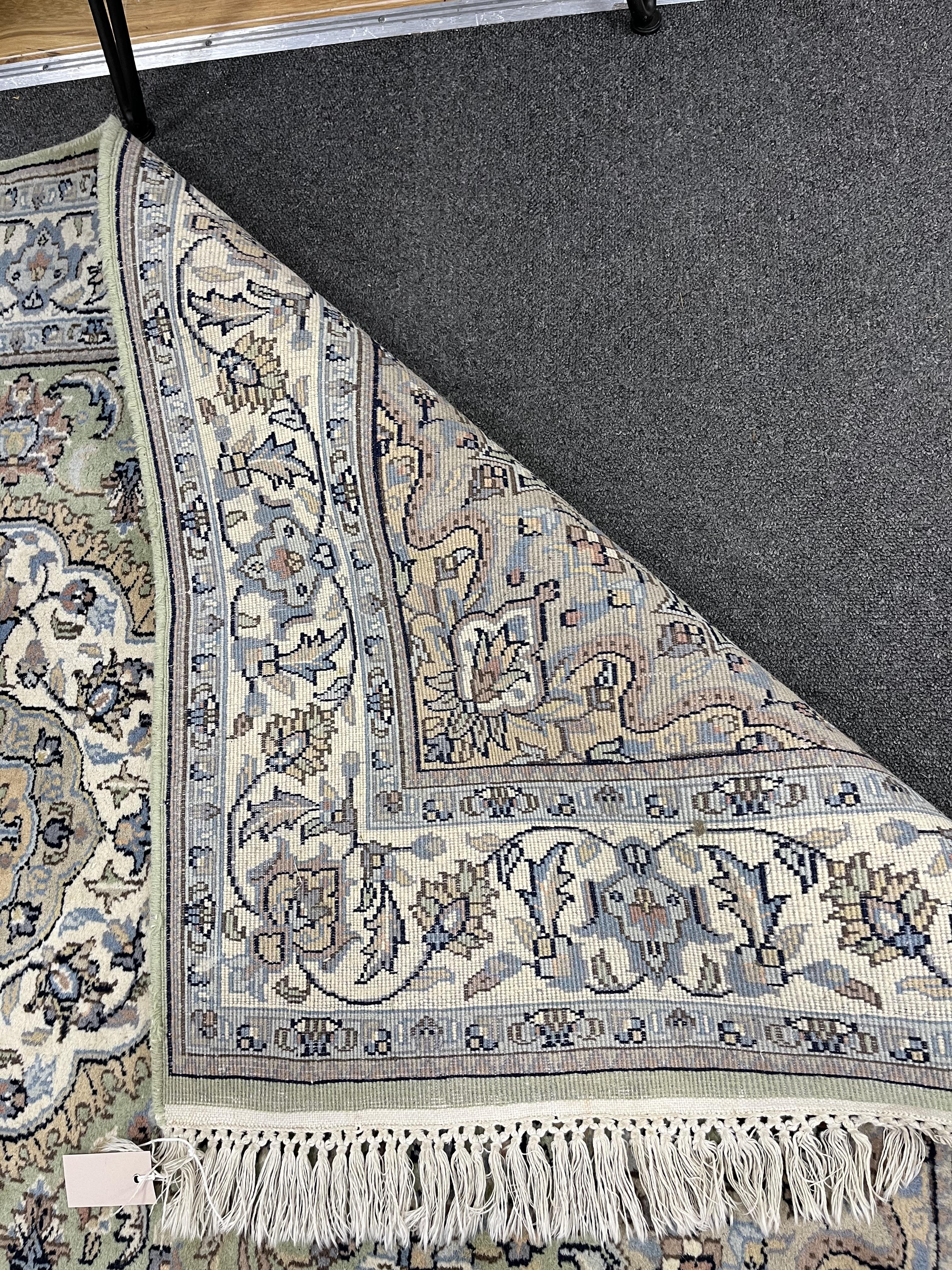 A North West Persian pale green ground rug, 180 x 120cm